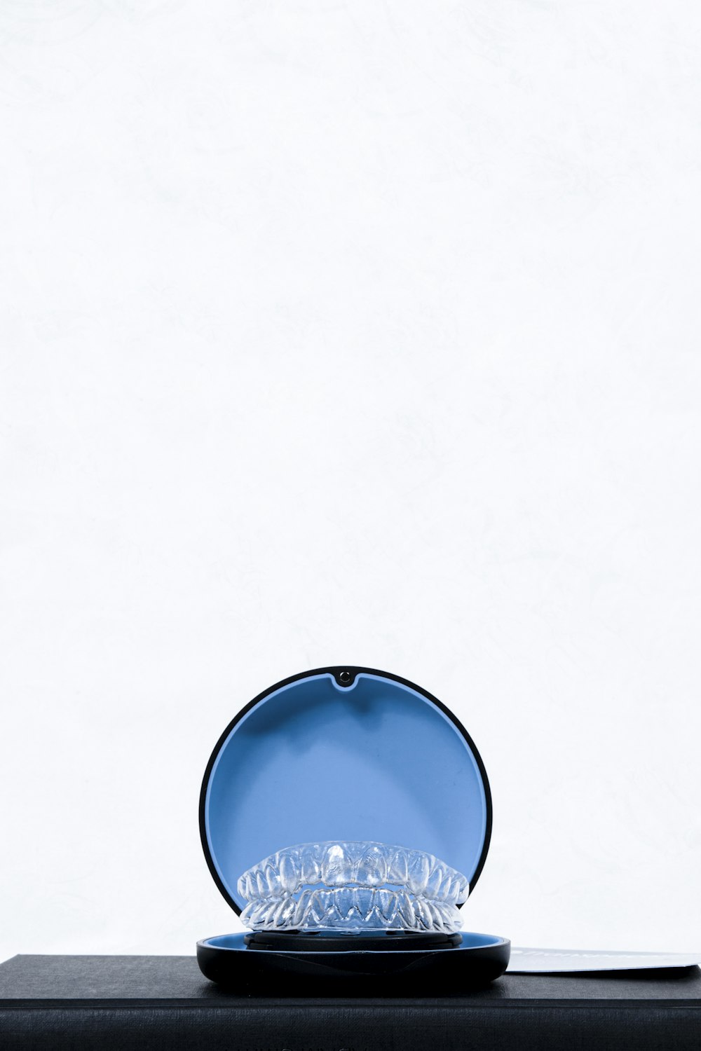 a blue bowl with a white background