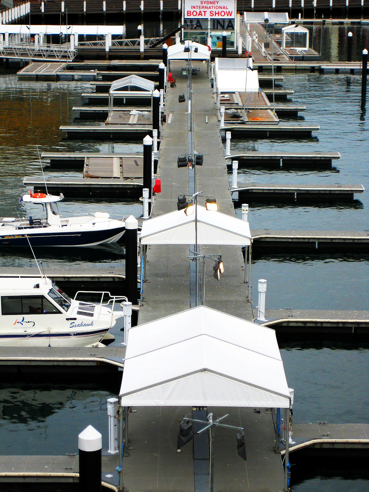 Boats moored along a Sydney harbour pier