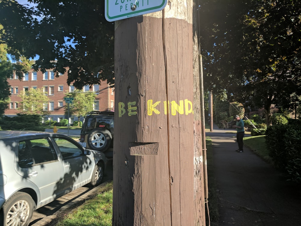 a wooden post with a sign on it