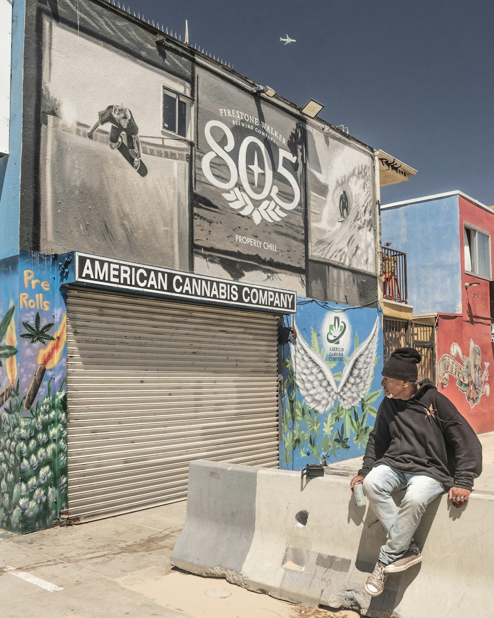 a man sitting on a wall