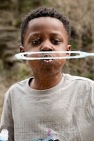 a boy with a tube in his mouth