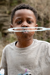 a boy with a tube in his mouth