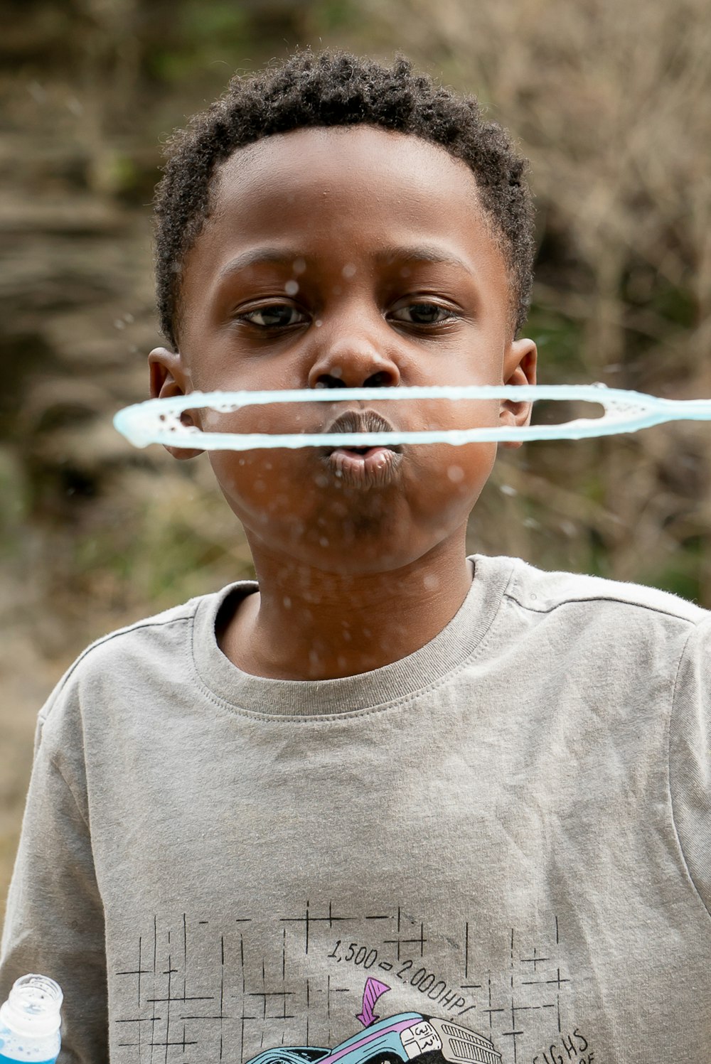 a boy with a tube in his mouth