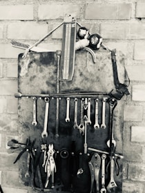 A collection of vintage tools neatly organized on a shelf.