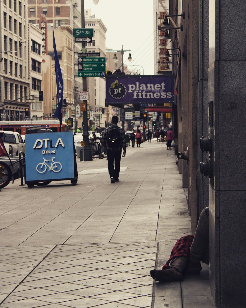 a person walking down a sidewalk