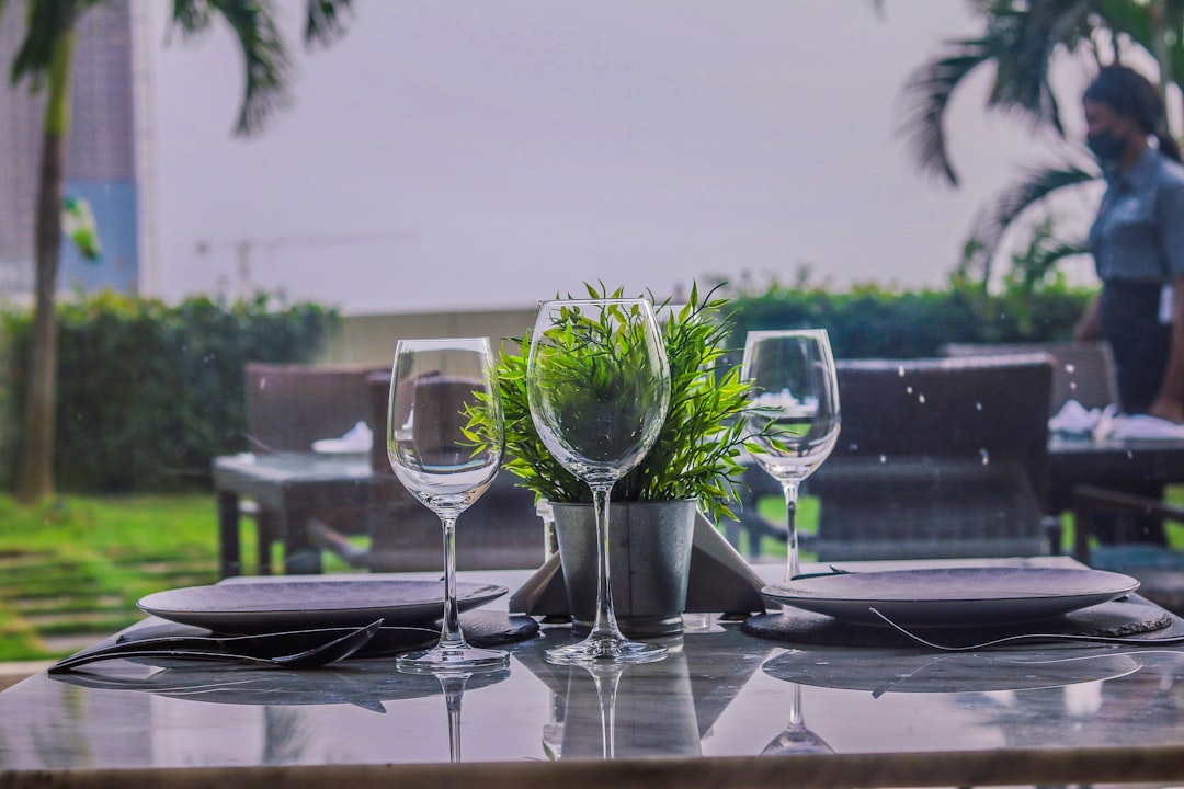 a set of wine glasses on a table, Fine dining settings