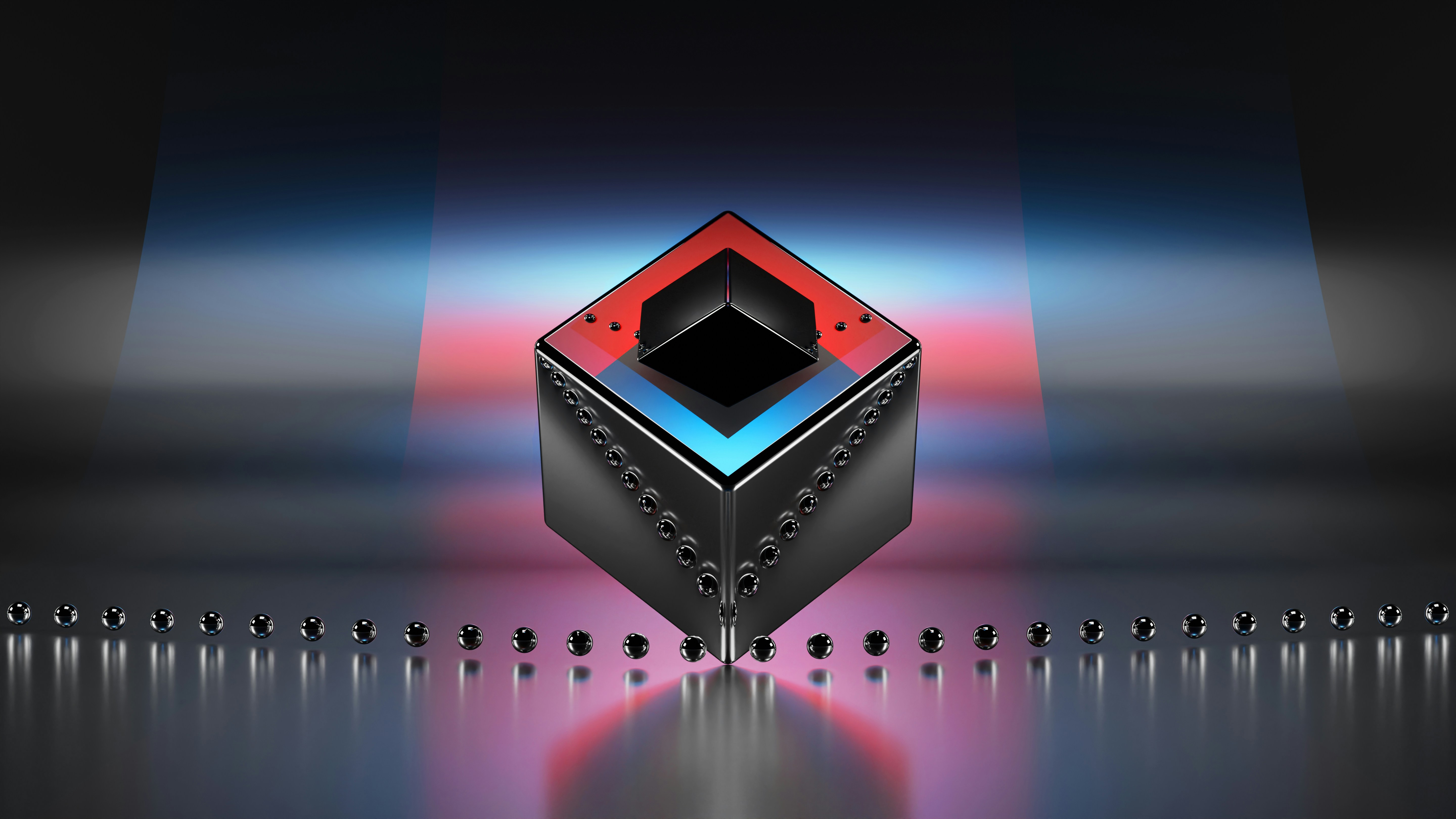 a red and black cube with a black and white design on it