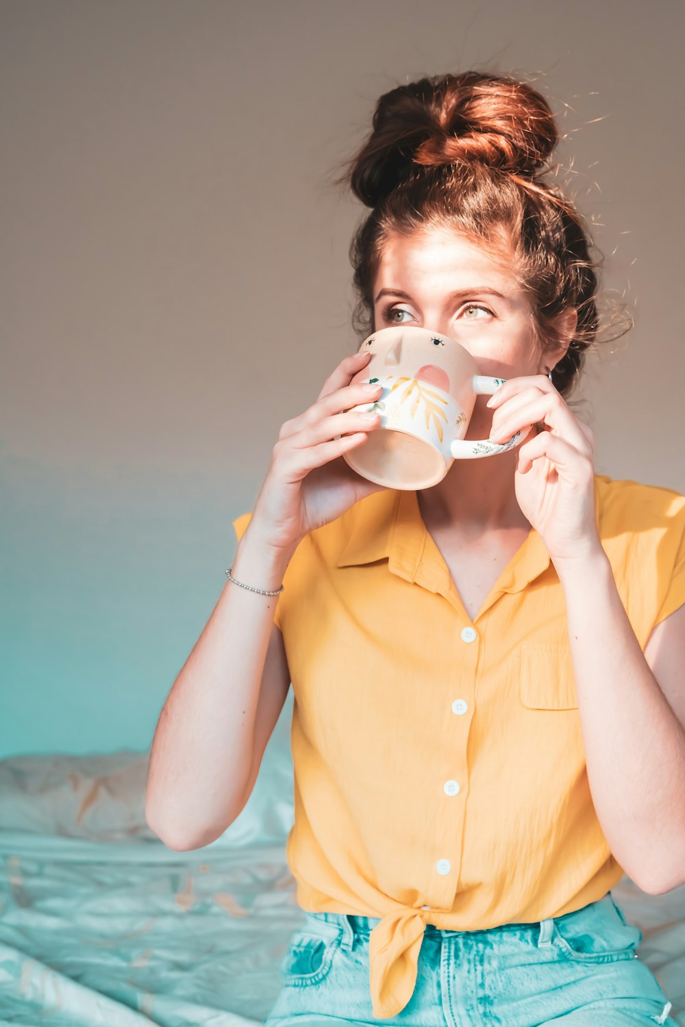 a person holding a cup