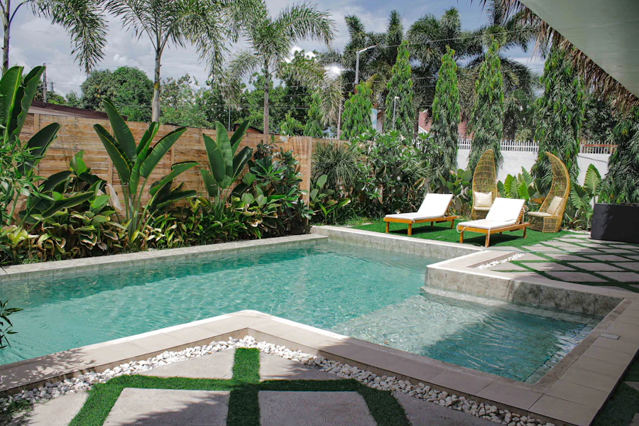 Family enjoying a beach resort swimming pool in Daman