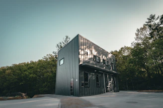 a building with trees in the back