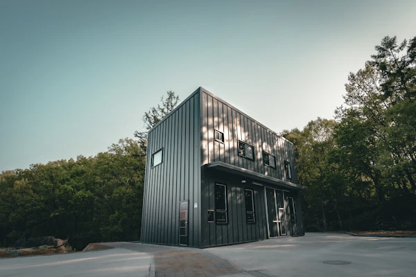 a building with trees in the back