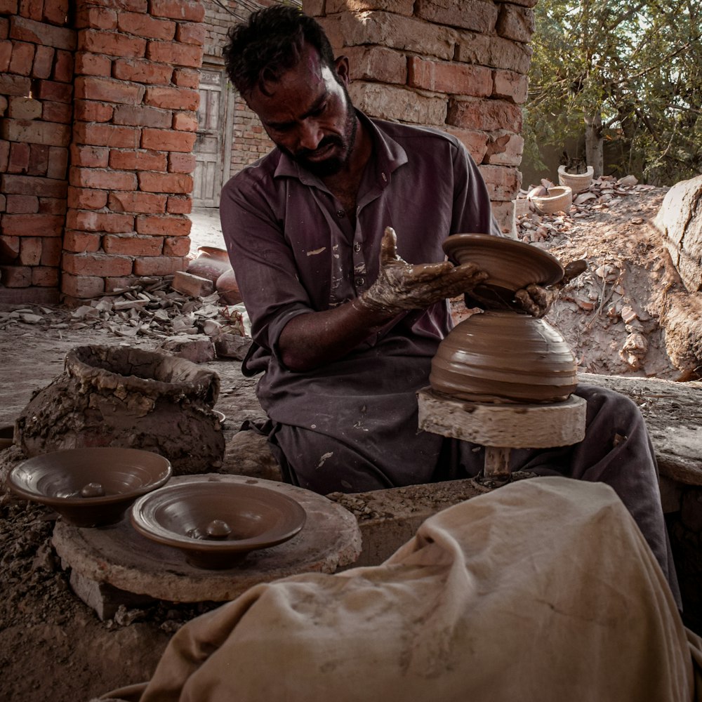 a man cooking outside