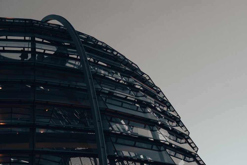 a tall building with a glass front