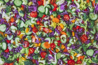A vibrant bowl of fresh, colorful vegetables arranged for a healthy meal.
