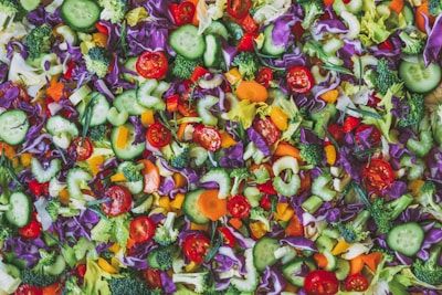 A vibrant bowl of fresh, colorful vegetables arranged for a healthy meal.