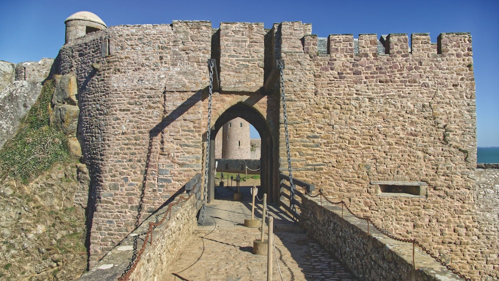 a stone wall with a walkway