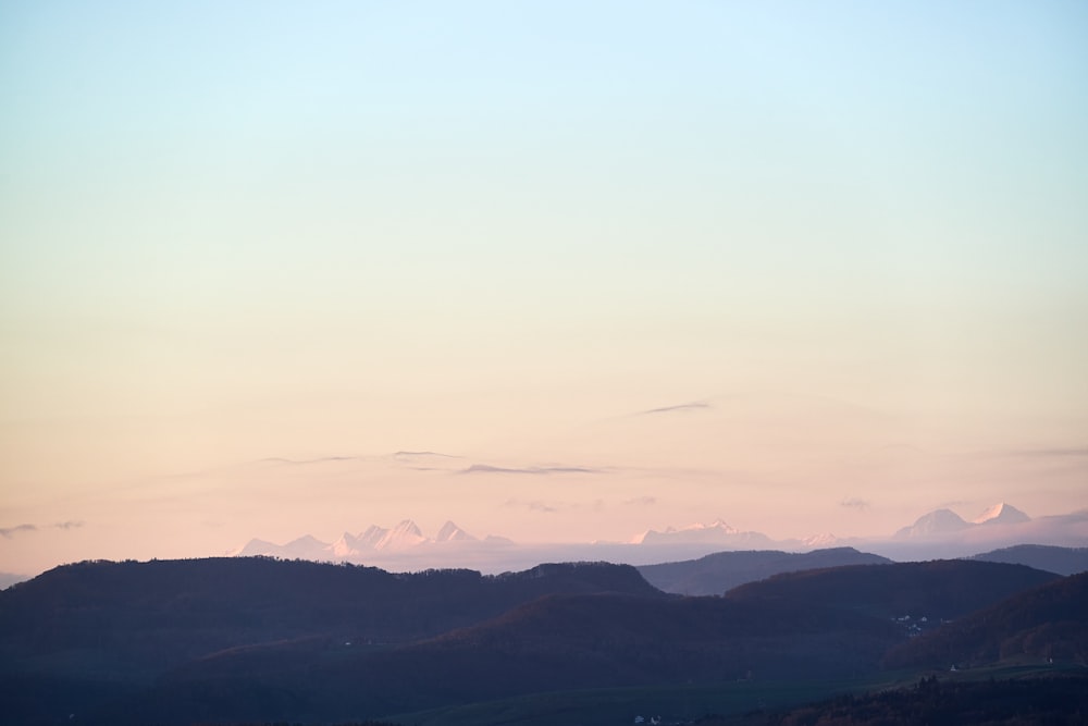 a view of mountains and the sky