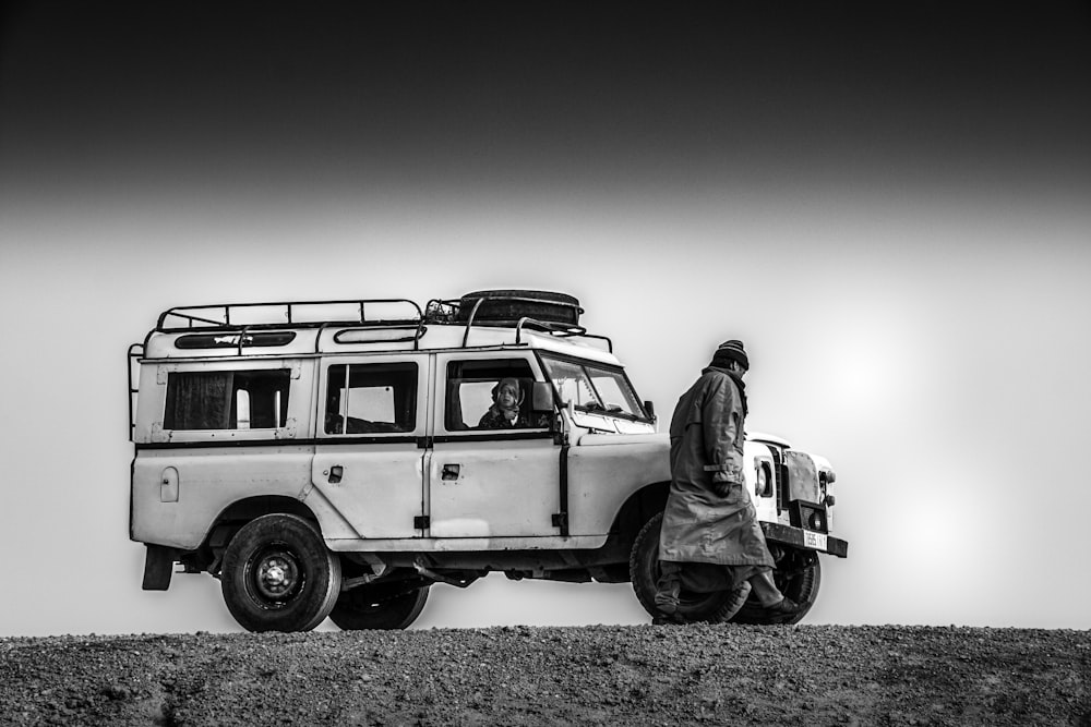 a person standing next to a van