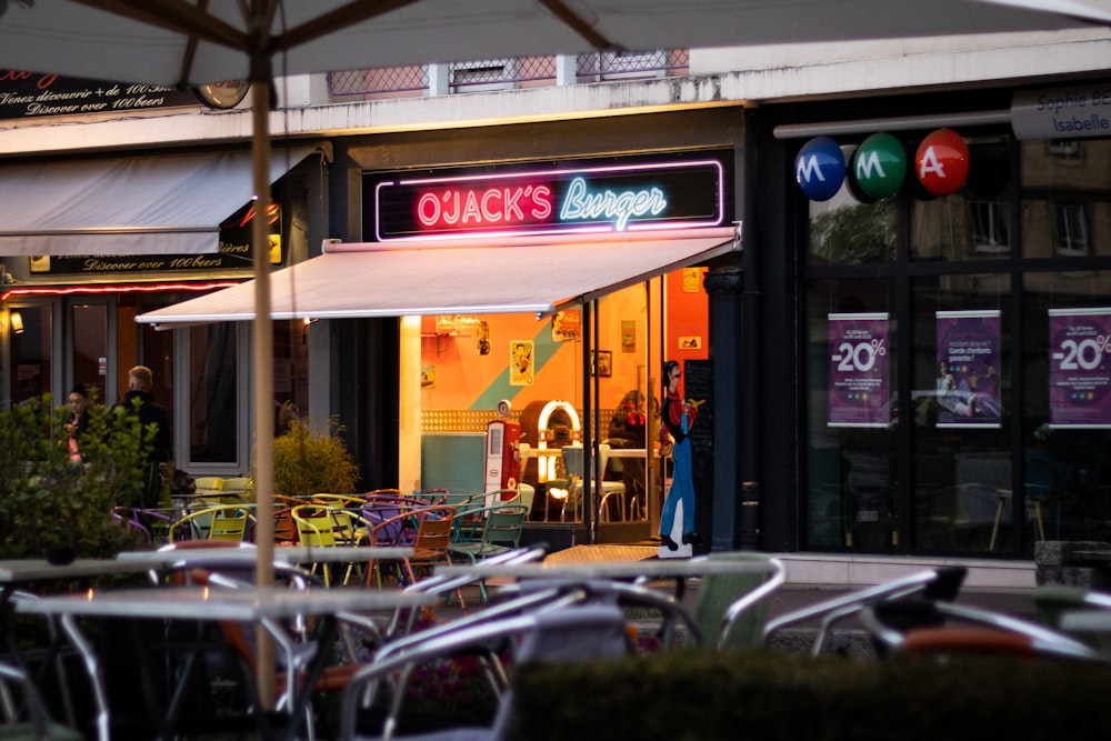 a restaurant with tables and chairs outside