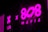 Bright pink neon signage with bold text displaying '808 Mafia' and 'LAB'. Reflective surfaces amplify the glow, creating a vibrant and urban atmosphere, typical of a nightclub or music studio.