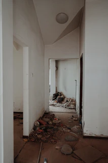 Common hallway in an apartment complex with visible dirt before cleaning