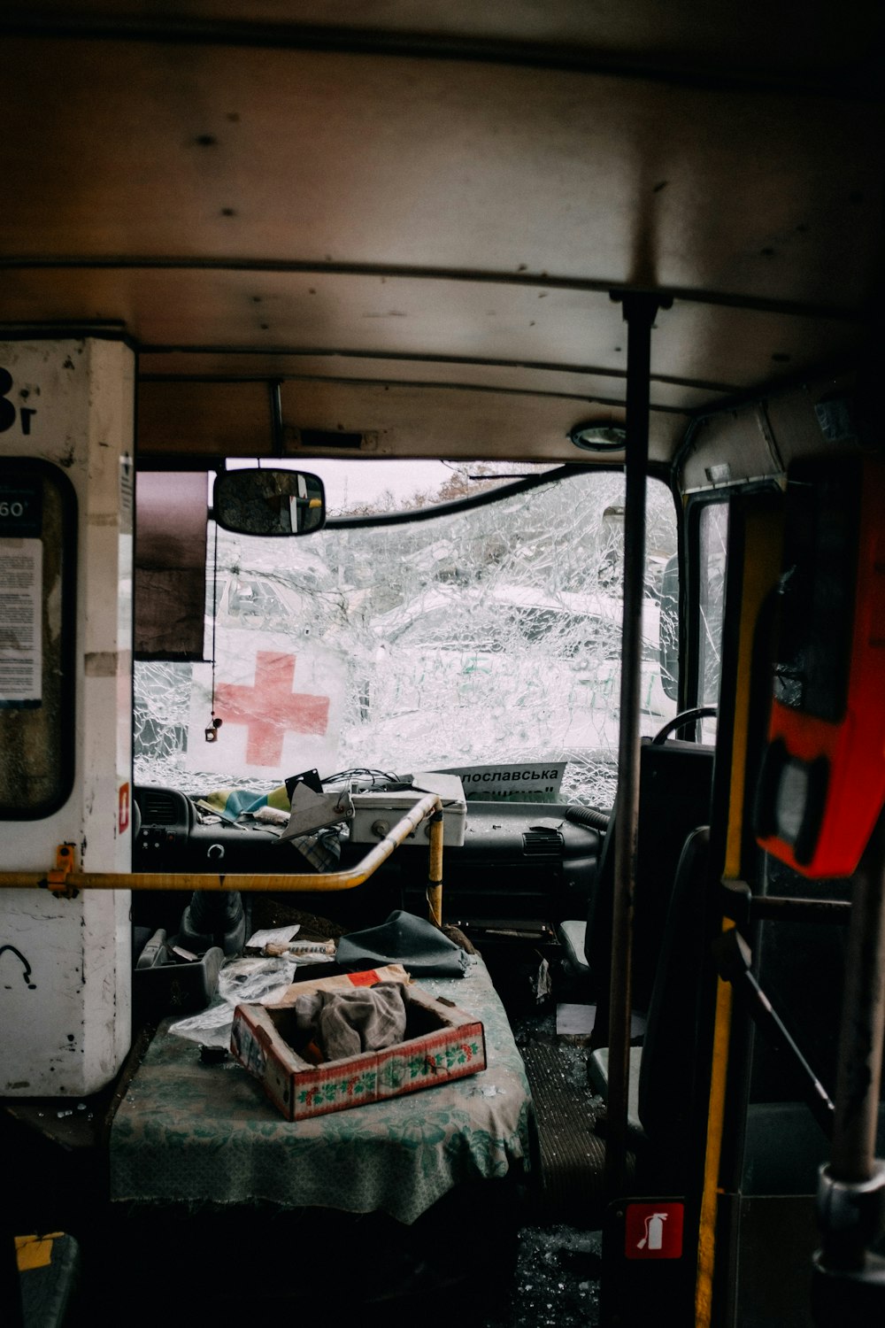 a bus with a pile of clothes in the back