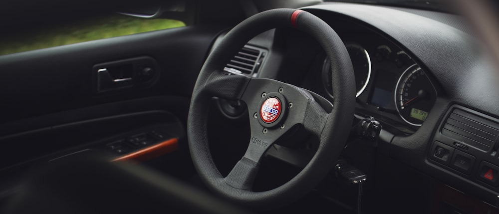 the steering wheel and dashboard of a car