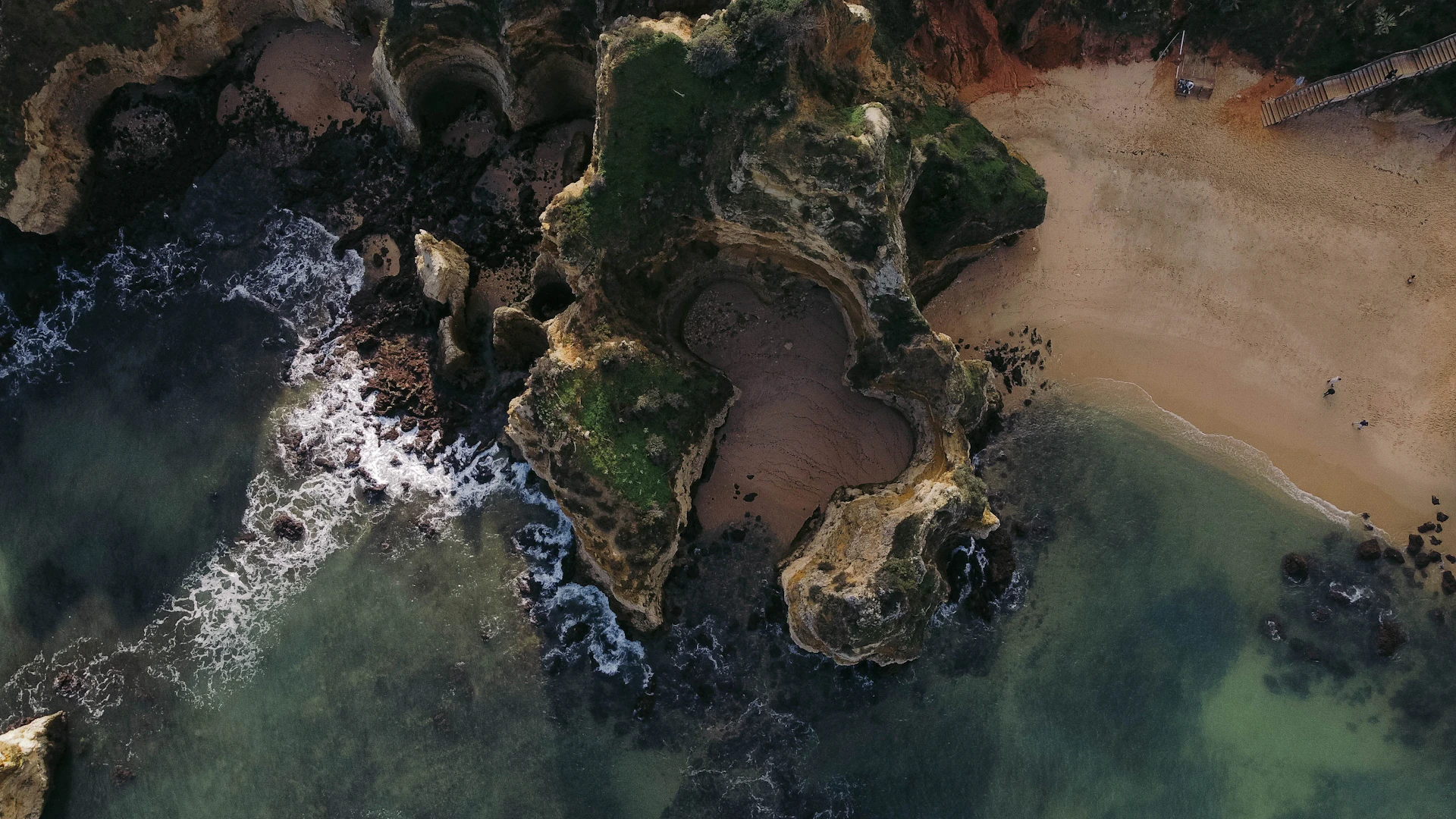 a large rock in the water