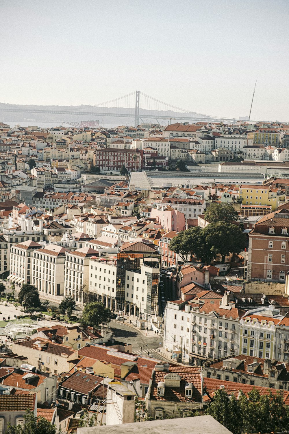 a city with a bridge in the background