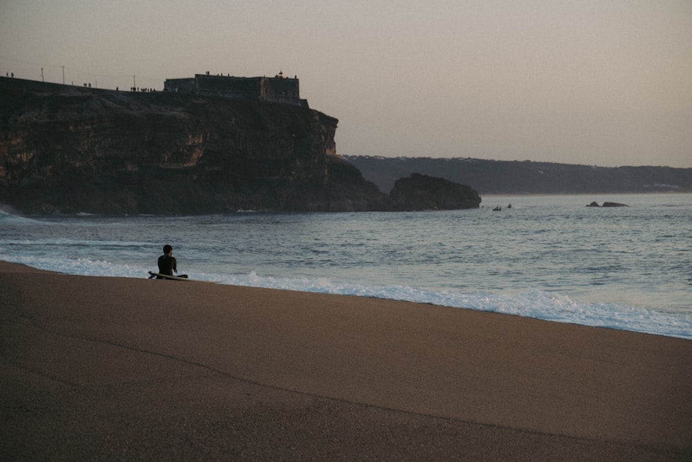 a person sitting on a beach