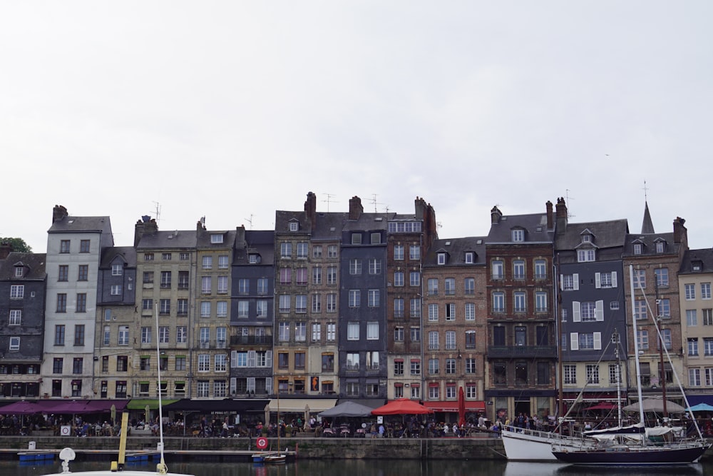 a group of buildings next to a body of water