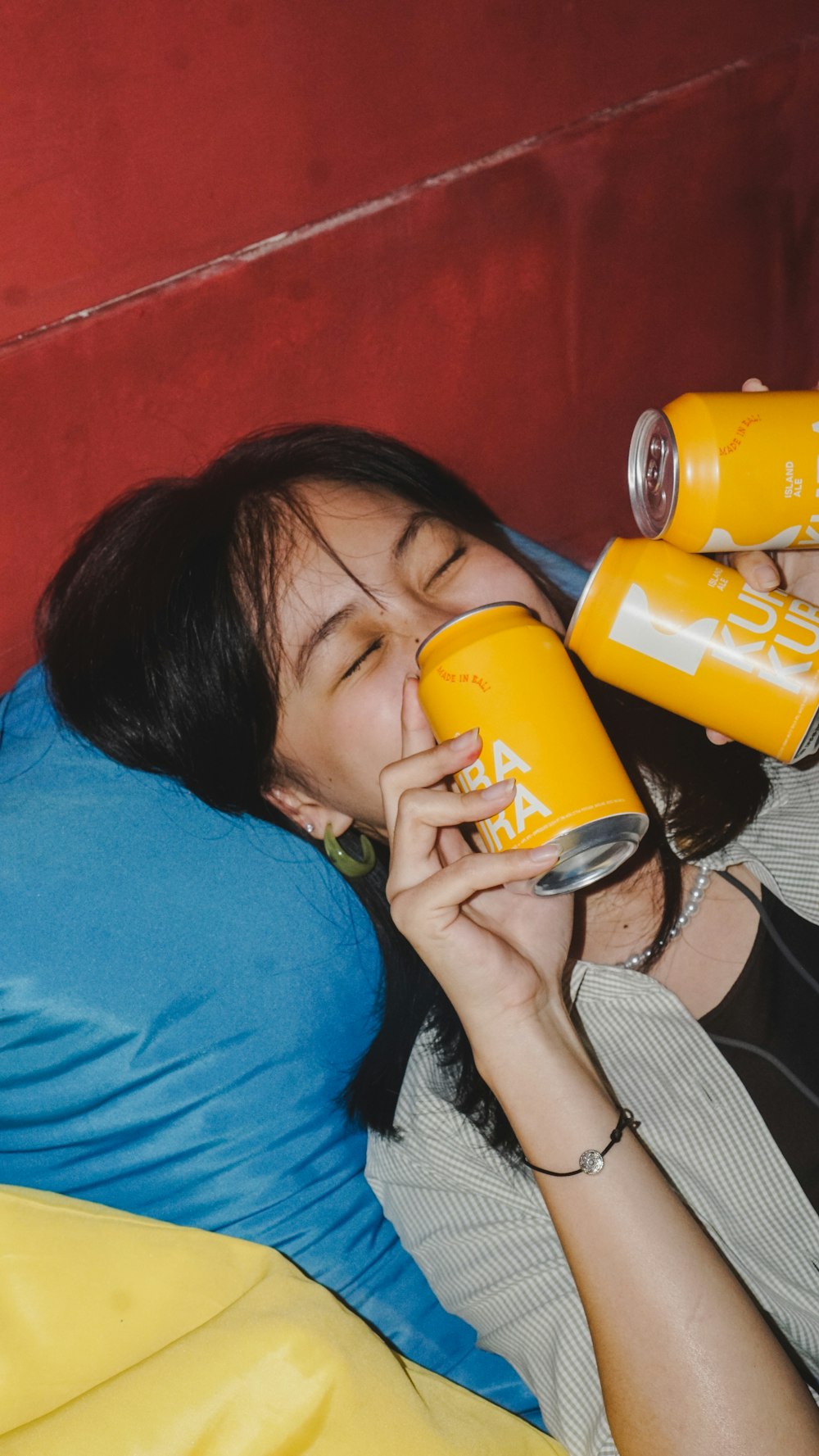 a woman drinking from a bottle