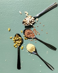 a group of spoons with food on them