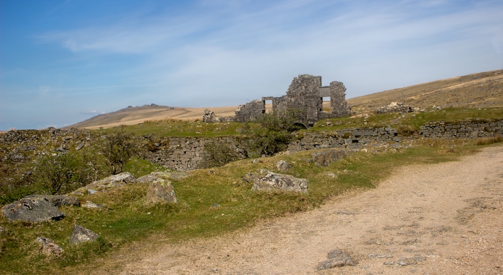 a stone building on a hill