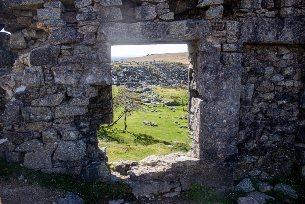 a view of a town through a stone window