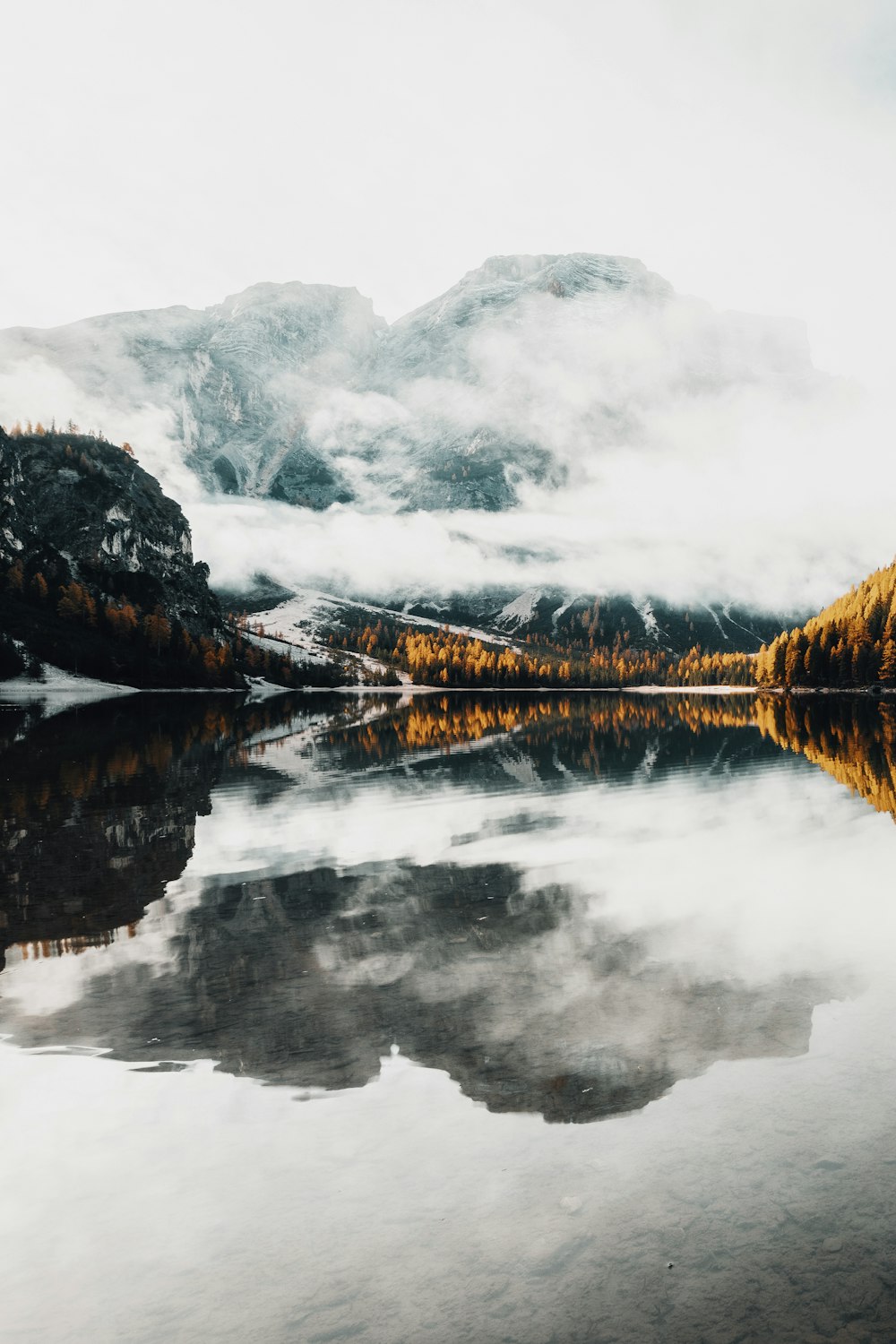 a body of water with mountains in the background