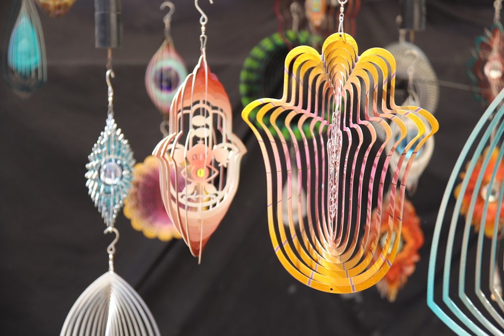 a group of colorfully decorated earrings