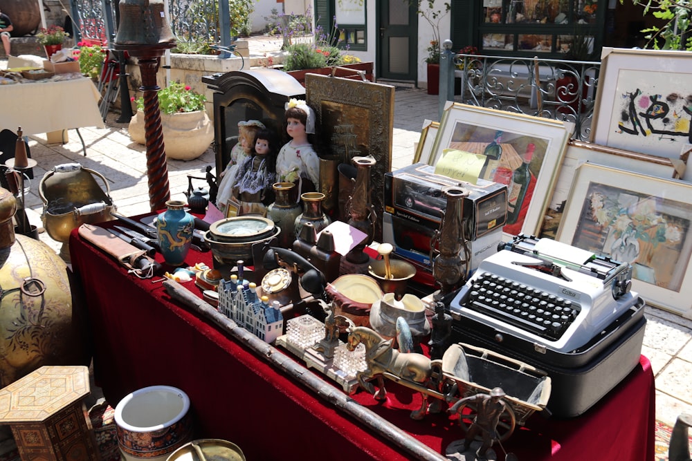 a group of people sitting at a table with a typewriter