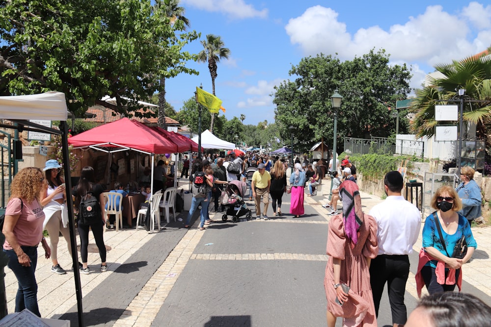 a group of people at an outdoor market