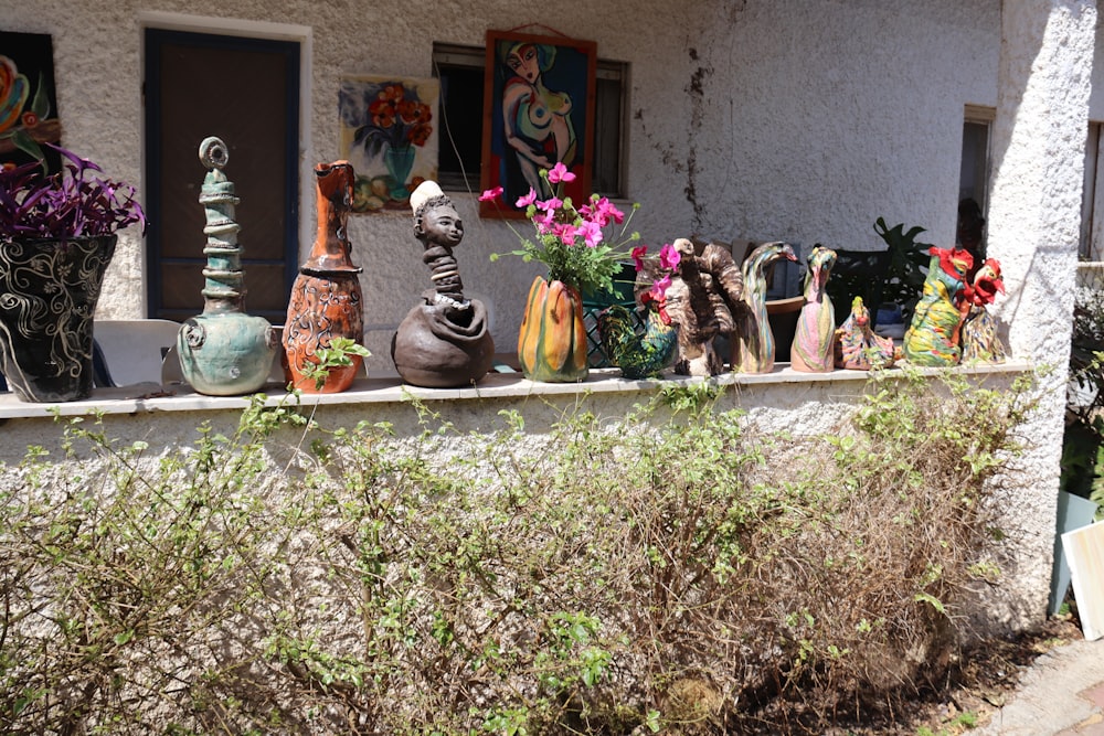 a garden with flowers and statues