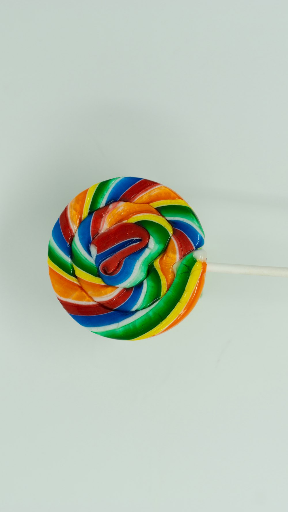 a colorful lollipop on a stick