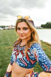 a person with a colorful shirt and sunglasses on the head
