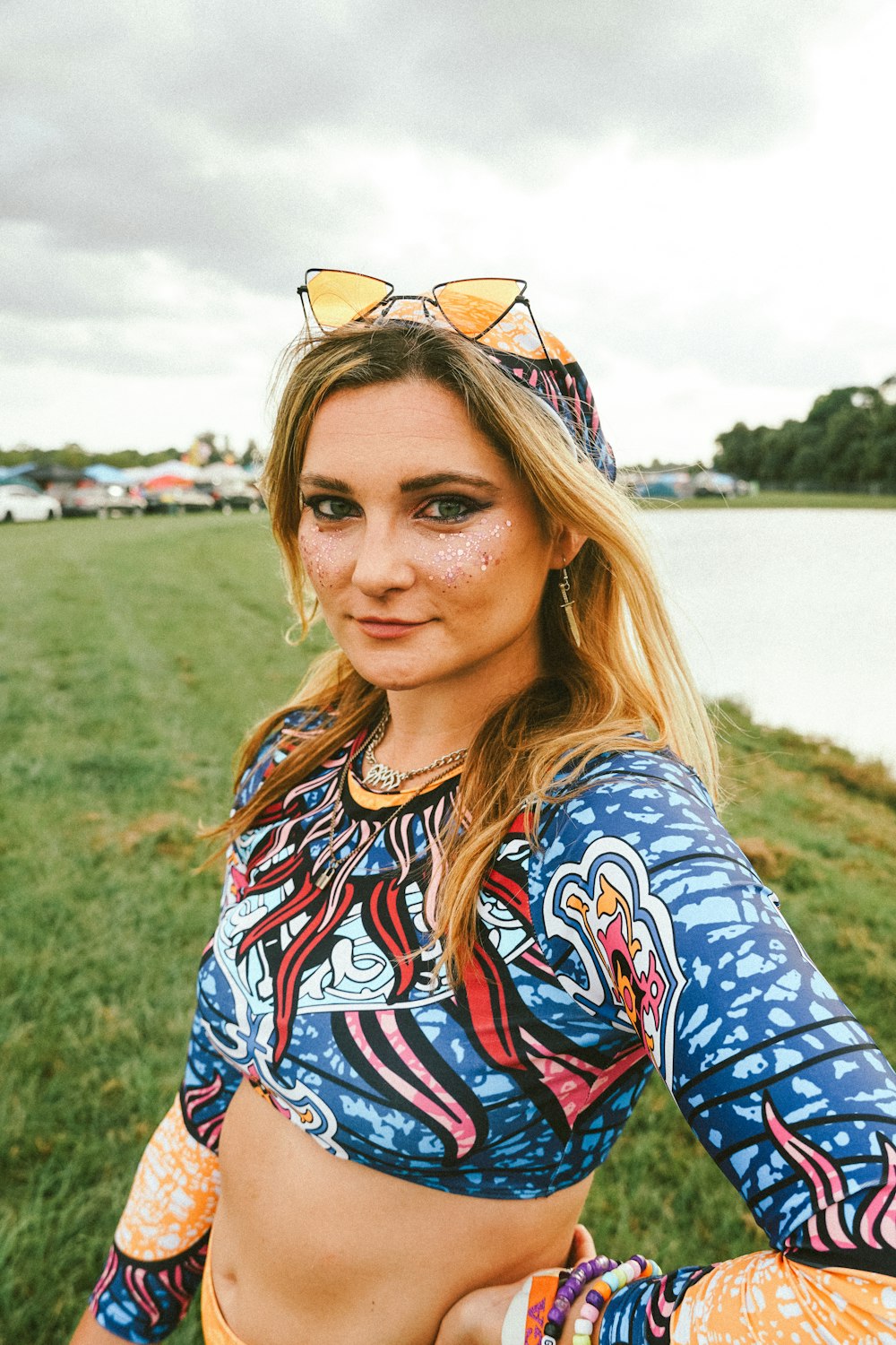 a person with a colorful shirt and sunglasses on the head