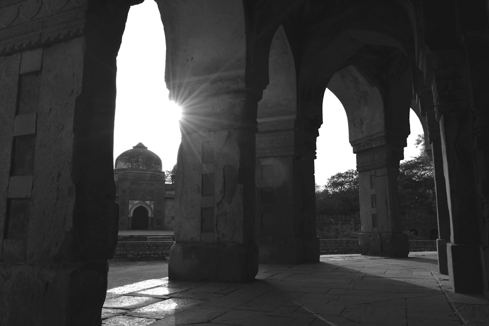 a stone walkway with pillars