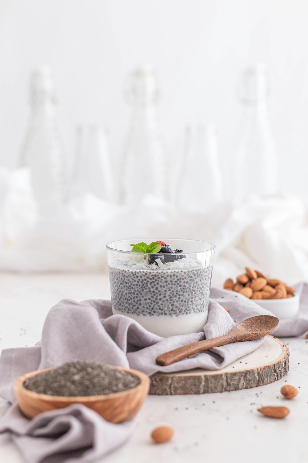 a glass cup with a plant in it and a spoon in it