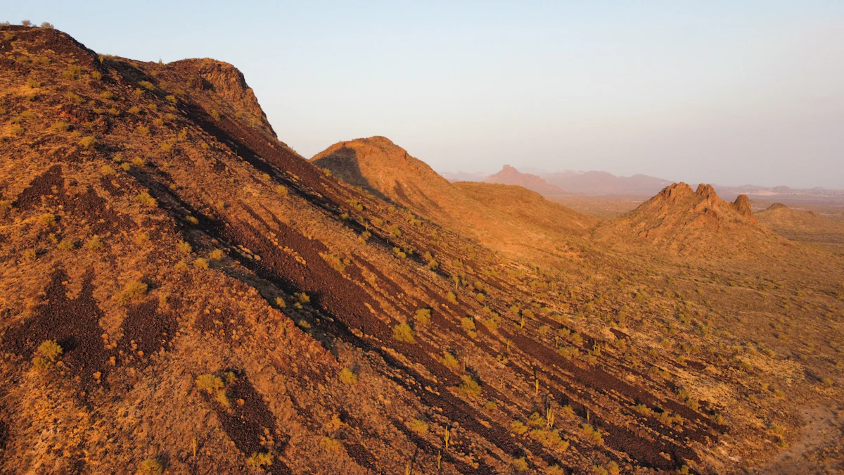 Rocky desert hills near Fountain Hills, Arizona, lit orange by a low sun