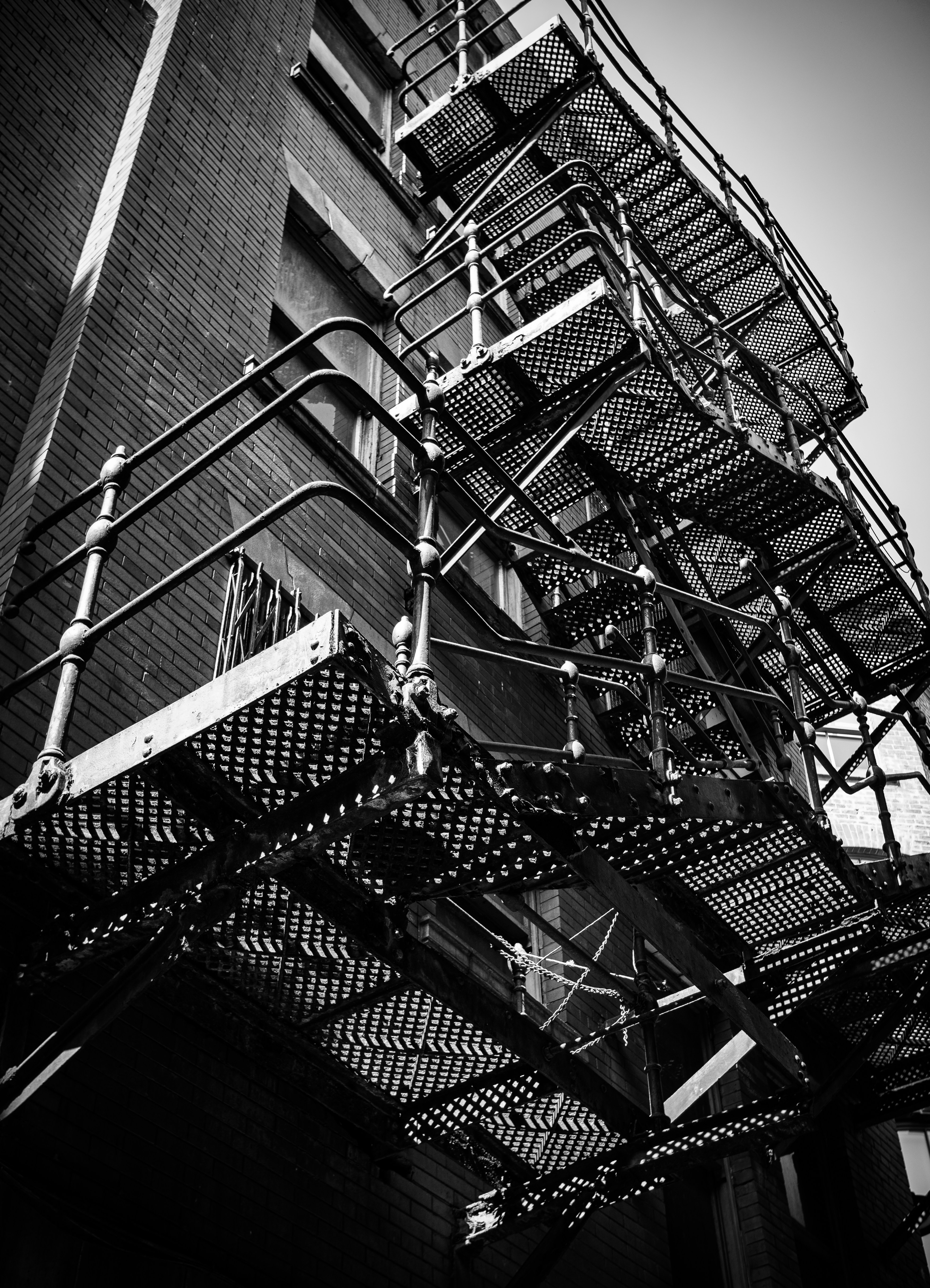 A fire escape in a back alley.
