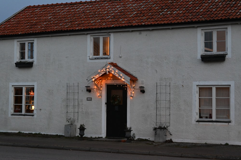 a white building with a red roof