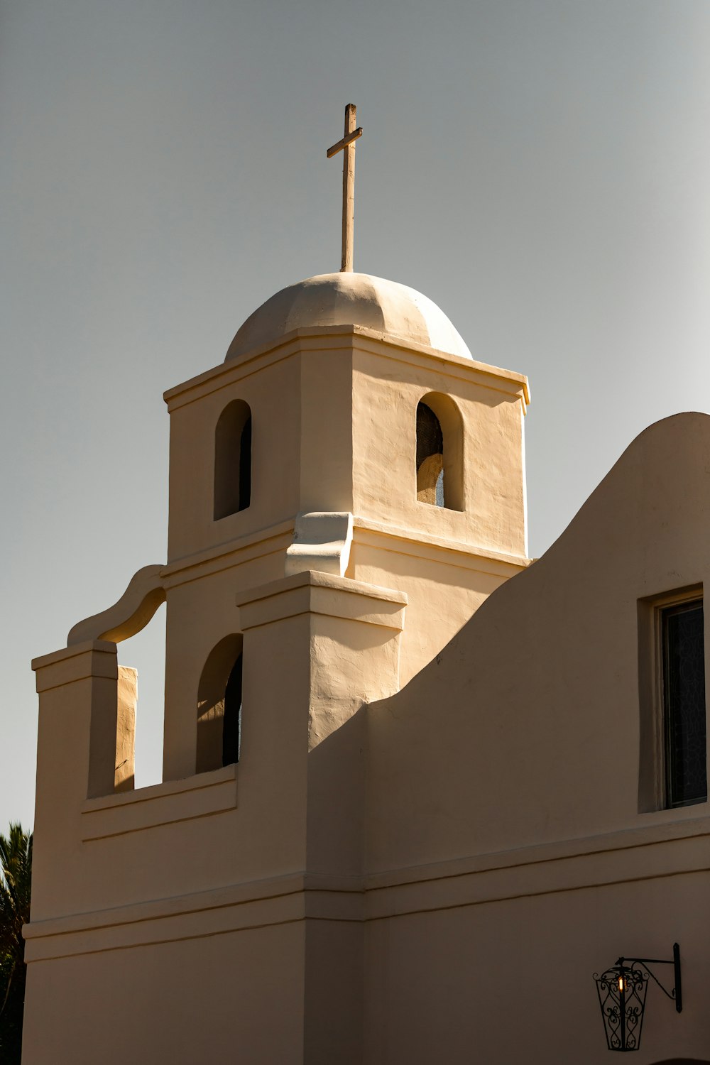 a white building with a cross on top