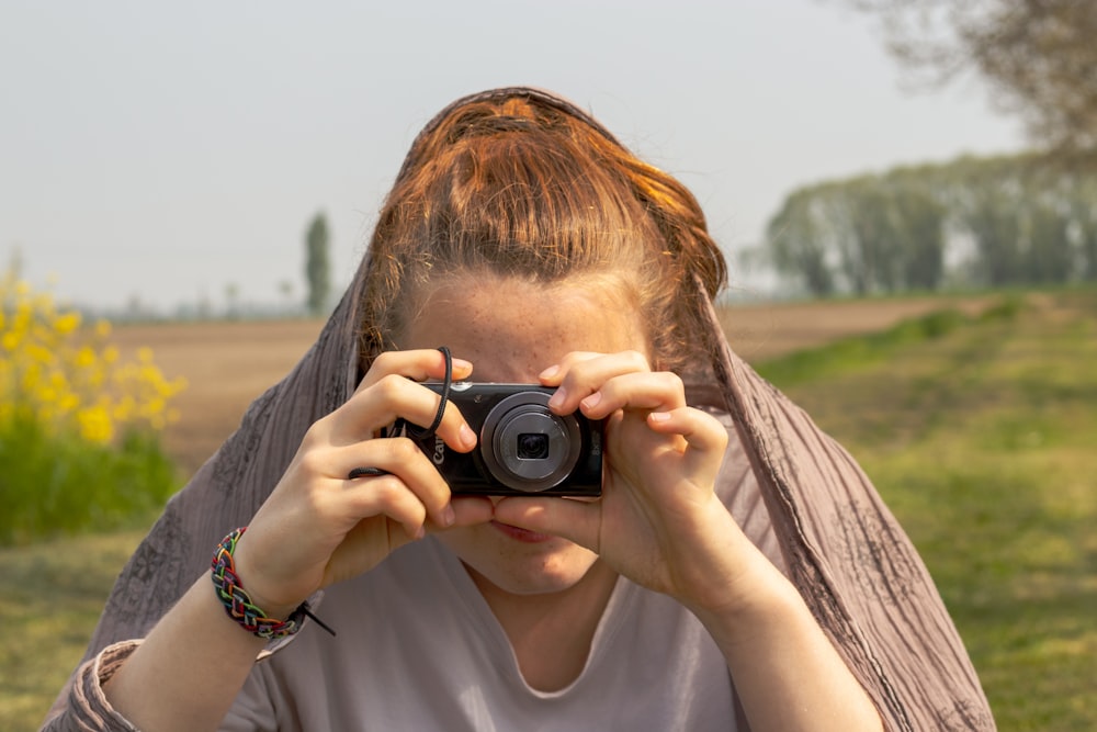 a person holding a camera